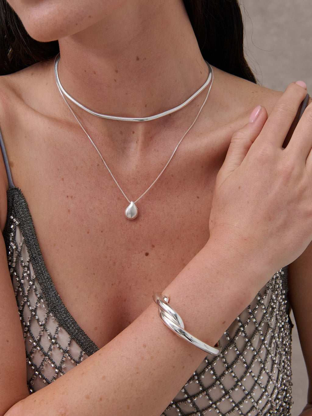 Mia Interlock Twist Bangle - Sterling Silver Plated