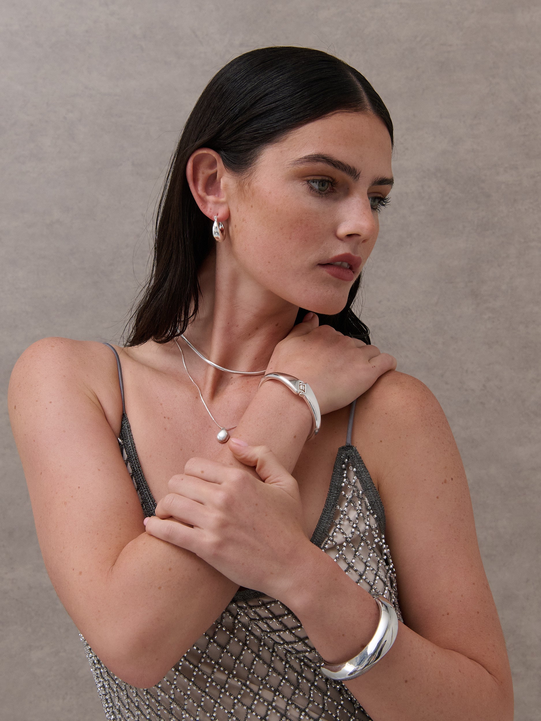 Mia Interlock Twist Bangle - Sterling Silver Plated
