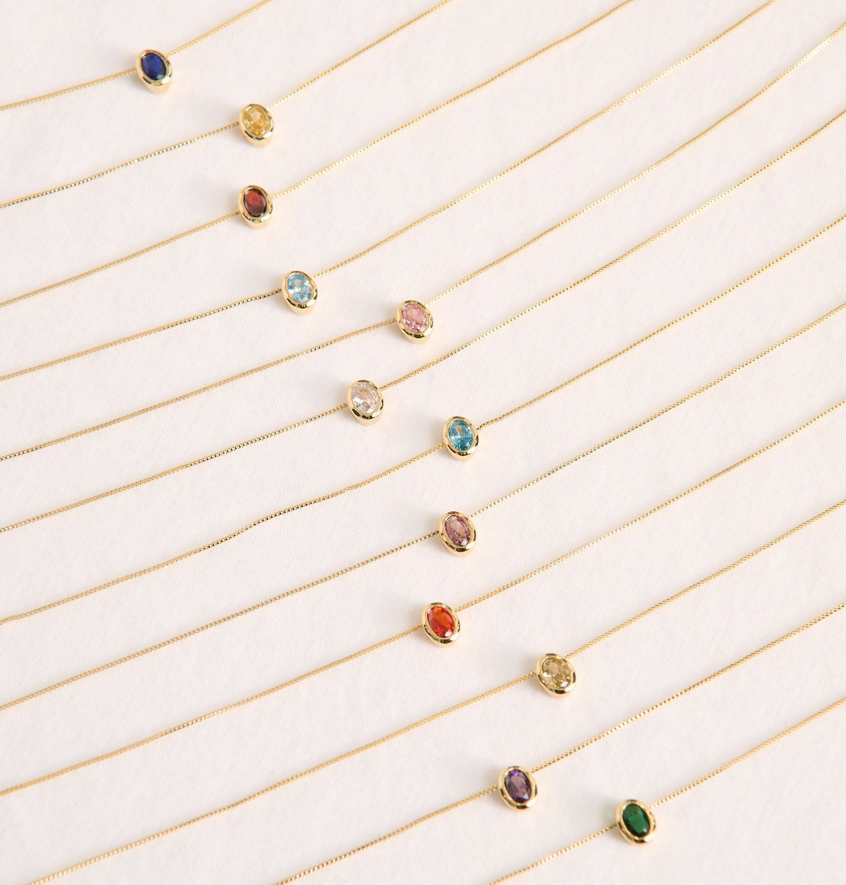 Set of beautiful gold birthstone necklaces made for personalisation or a meaningful gift